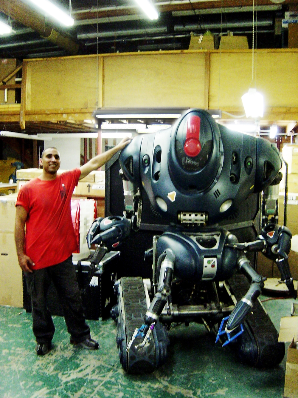A mover next to a robot at the Jim Henson workshop