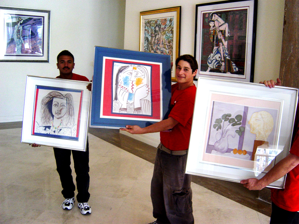 NorthStar Movers holding three original Picasso's during a move in a Bel Aire mansion