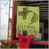 NorthStar Moving crew members carrying out the Global Green sign